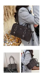 Dettaglio della borsa tote in pelle opaca marrone scuro con fibbie e cinturini argento regolabili