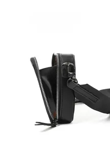 Detail view of mini envelope crossbody bag with internal divider and silver zipper