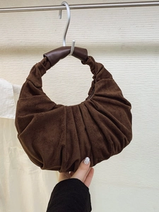 Minimalist dark brown pleated crescent handbag made of soft vintage faux suede material