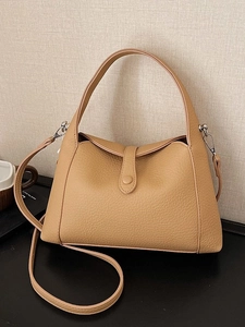 Vintage khaki pebbled leather underarm bag with adjustable strap and silver buckle closure