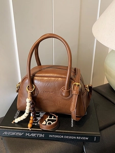 Retro deep brown leather bowling bag with vintage charm and bead charm accessory
