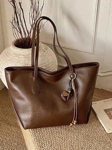 Large dark brown PU leather tote bag with elegant flower charm for stylish commuting