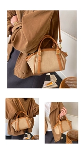 Detail of woven fabric crossbody bag with brown leather trim and golden metal hardware