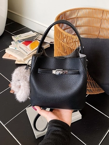 Classic black litchi pattern leather bucket bag with silver metal lock and gray fur pompom