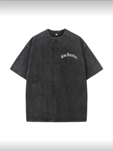 Detail of Los Angeles embroidery on vintage washed black heavyweight cotton t-shirt
