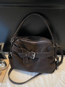 Large dark brown faux leather tote bag with white stitching and decorative buckle