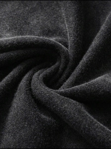 Close-up of vintage washed dark gray cotton fabric with heavy weight knit texture