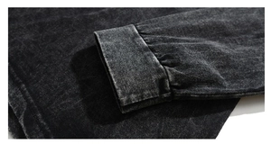 Close-up of heavy cotton sleeve with vintage acid wash texture and precise stitching