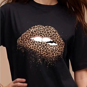 Women's black crew neck T-shirt featuring a stylish leopard print red lips graphic