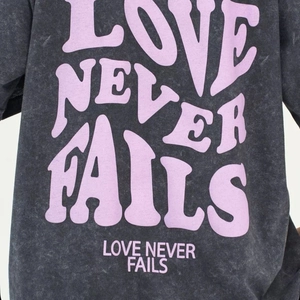 Washed charcoal cotton heavy T-shirt with Love Never Fails print in a vintage loose fit