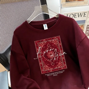 Burgundy cotton long sleeve t-shirt with Born Again print and vintage carpet pattern