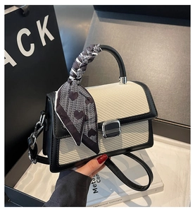 Contrast crossbody bag with woven texture, metal lock, and scarf-wrapped handle