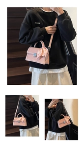 Pink woven crossbody bag detail featuring square metal buckle and printed silk scarf accessory