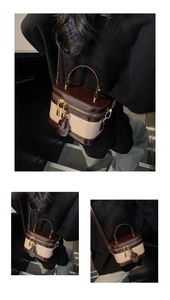 Detailansicht einer Vintage-Box-Tasche mit zweifarbigem Kunstleder und Doppelreißverschluss