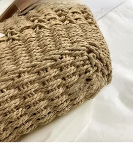 Close-up of woven straw texture and natural plant fiber detail on summer beach bag