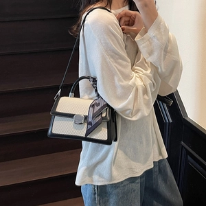 Minimalist beige and black contrast crossbody bag with silk scarf on handle