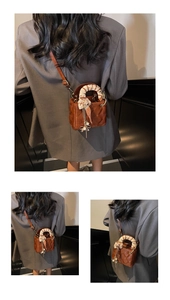 Detail of brown quilted mini crossbody bag with silk scarf handle and pearl tassel charm