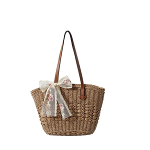 Fashion woven straw tote bag with brown leather handles and pink floral lace bow