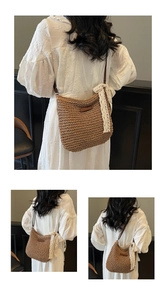 Detail of woven straw shoulder bag with white lace bow and brown leather accent patch