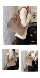 Macro view of brown faux fur tote bag with braided handles and a cute cartoon plush charm