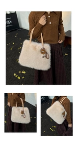 Detail of soft plush tote bag with woven rope handles and a leopard print doll charm
