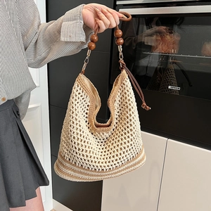 Beige hollow woven shoulder bag with large capacity and wooden bead strap accents