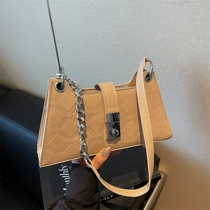 Elegant beige underarm bag with Greek key embossed pattern and silver chain strap