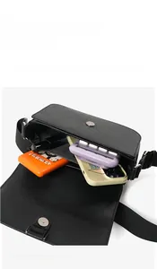 Capacity display of the black PU leather crossbody bag showing internal storage space