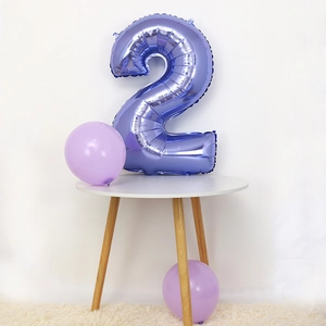 Detail of 30-inch blue number 2 foil balloon with metallic finish for birthday party decor