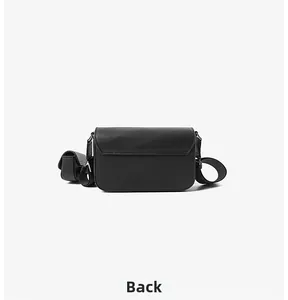 Back view of a minimalist black PU leather crossbody bag with adjustable wide strap