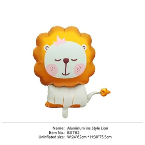 Detail of lion head foil balloon with pink crown and golden finish for party decor