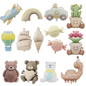 Various cute macaron cartoon balloons including airplanes and bears for birthday parties
