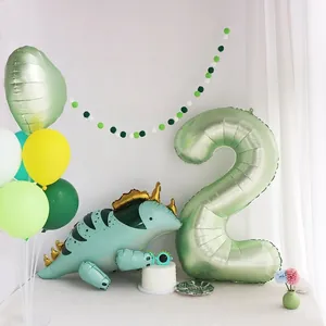 Forest green dinosaur 2nd birthday party set with balloons and pom pom banner
