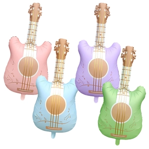 Detail of four guitar-shaped foil balloons in pastel colors for party decorations