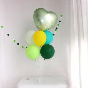 Green balloon bouquet kit with heart foil and latex balloons on table display stand