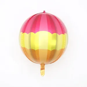 Detail of 4D round aluminum foil balloon with pink yellow and orange stripes for parties