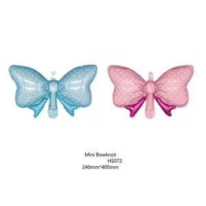Mini 16-inch candy bowknot foil balloons in blue and pink polka dots for birthday decor