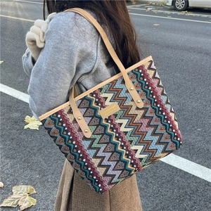 Ethnic bohemian tote bag with colorful chevron woven pattern and brown leather handles