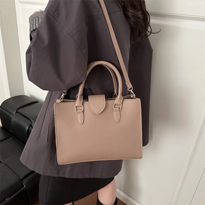 Elegant beige lychee texture small square bag with top handles and gold-tone hardware