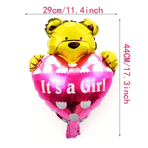 Detailed view of yellow mini bear foil balloon with pink It's a Girl heart design