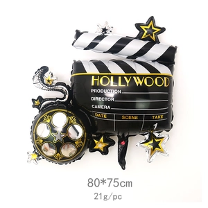 Detail of Hollywood movie clapperboard and film reel foil balloon for party decoration
