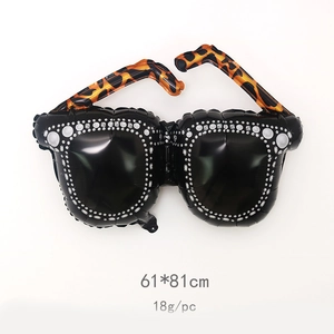 Detailed view of oversized sunglasses foil balloon measuring 61x81cm for party decor