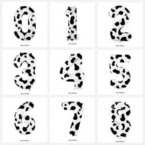 Detail view of 40 inch cow print foil balloons showing digits zero to eight in a grid layout