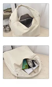 Detailed interior of the beige nylon tote bag showing spacious capacity and striped lining