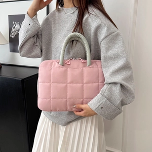 Quilted pink waterproof briefcase with green handles for laptop and office documents