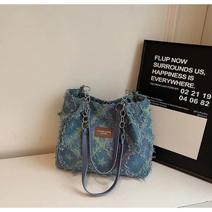 Retro denim tote bag with star jacquard patterns and distressed frayed edges