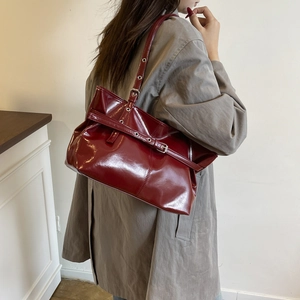Chic burgundy waxed leather tote bag for women with adjustable straps and silver eyelets