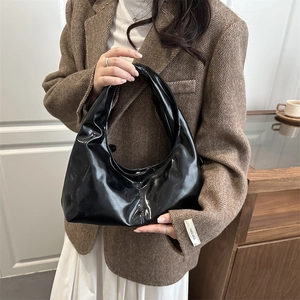 Classic black glossy faux leather hobo shoulder bag for women in a minimalist French style