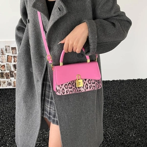 Chic leopard print crossbody bag with pink flap and gold padlock on grey wool coat