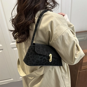 Retro leopard print underarm bag with gold lock buckle and minimalist shoulder strap style